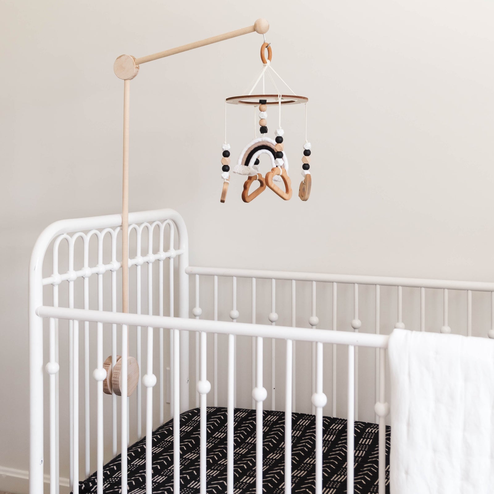 Baby looking at a mobile in a crib